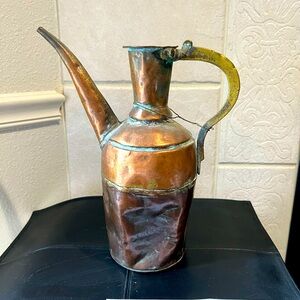 Antique copper watering can